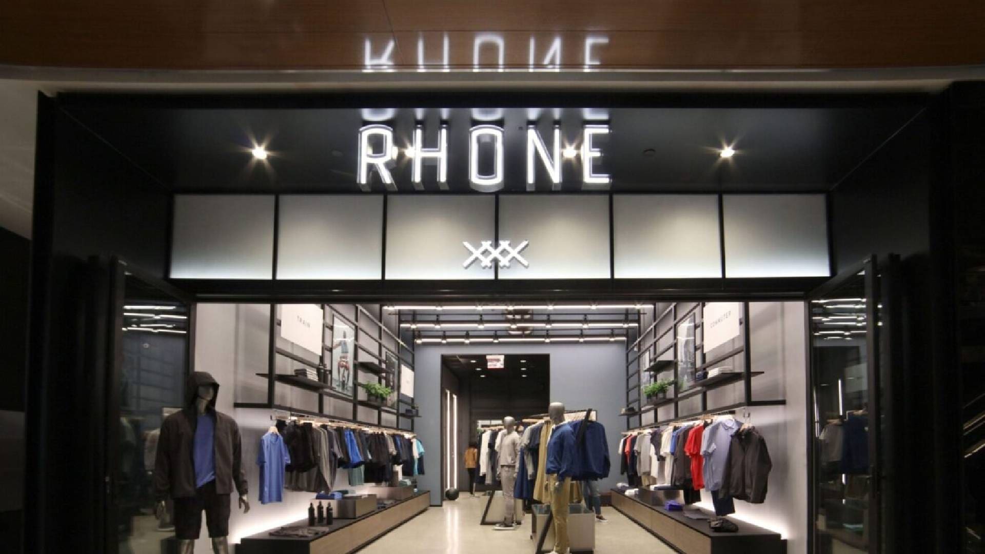 A store front with people walking around it.