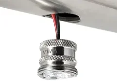 Close-up of a metallic knob with red and black wires.