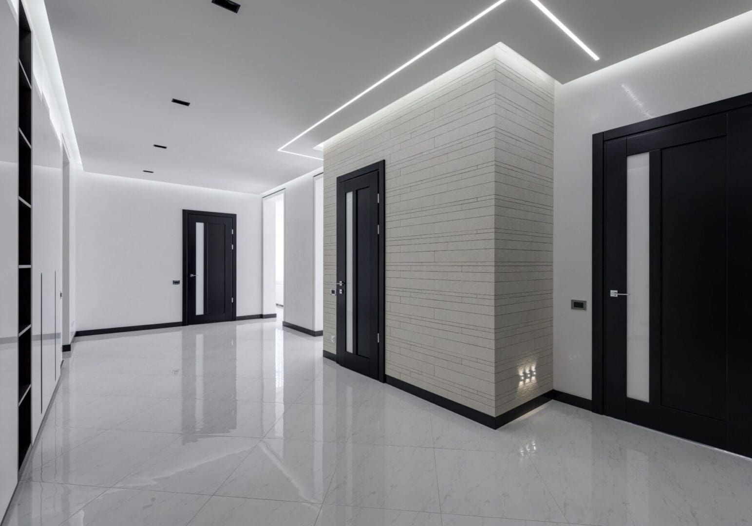 Modern interior with sleek black doors and bright white walls.