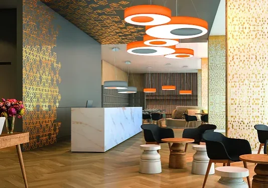 Modern lobby with unique ceiling lights and stylish seating arrangement.