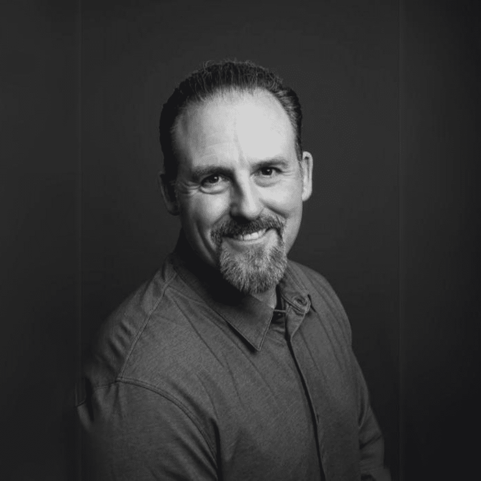 A man with a beard and mustache wearing a shirt