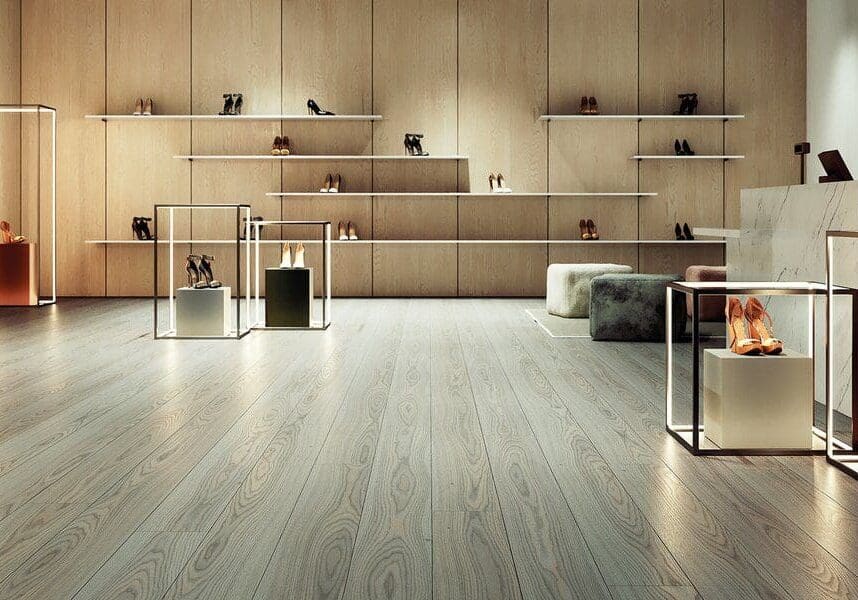 Minimalist room with wooden shelves and light hardwood floor.