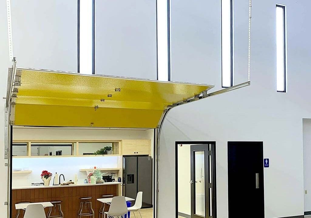 A large open room with white walls and yellow ceiling.