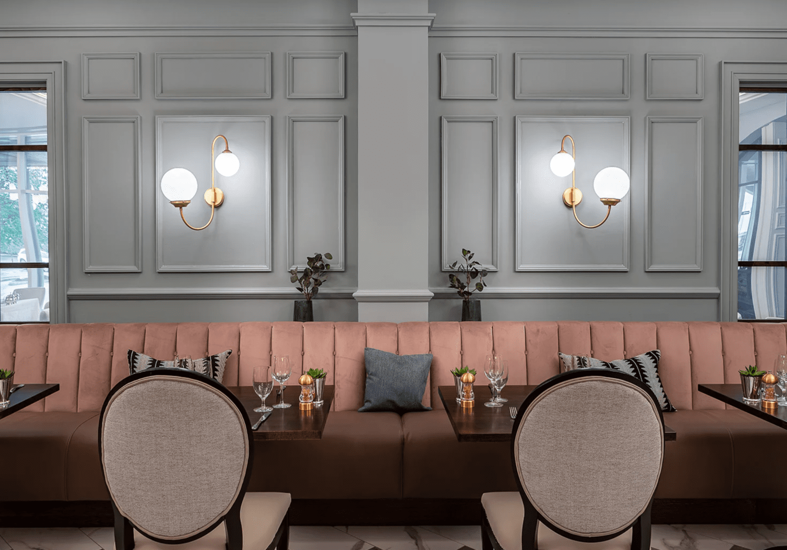 Elegant dining area with plush seating and soft lighting.