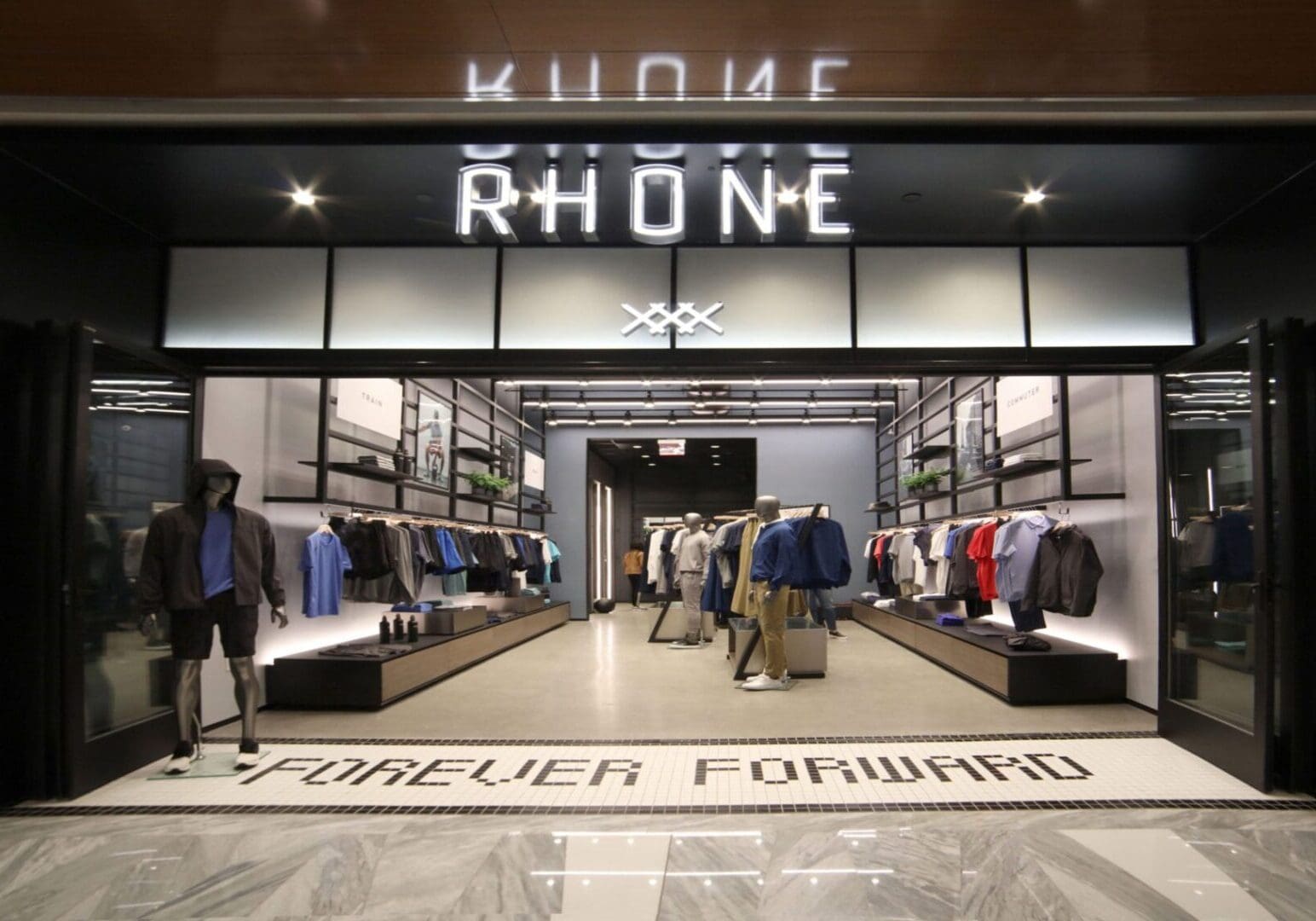 A store front with people walking around it.