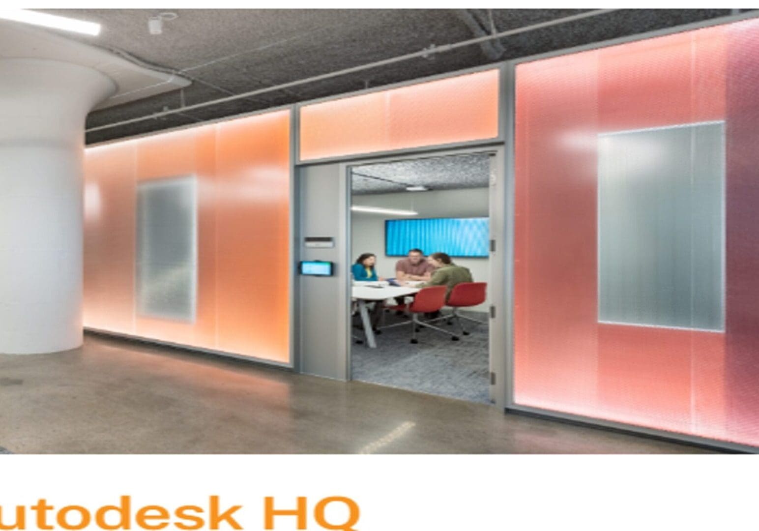 A group of people in an office setting.